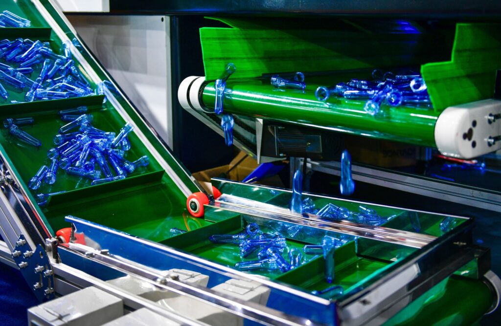 Blue,plastic,bottles,in,production,line,at,manufacturing,pet,perform,